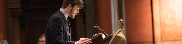 Teenage Lector reading at Eagle Lectern