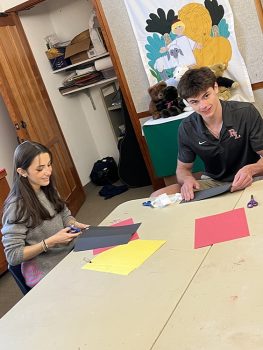 Oliver and Maggie work ahead in one of the Parish House classrooms to make hats for Pentecost, which was June 8, 2025.