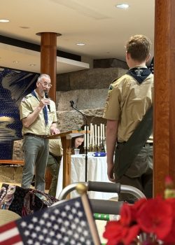 Henry waits as Scoutmaster Eric Arcese speaks.