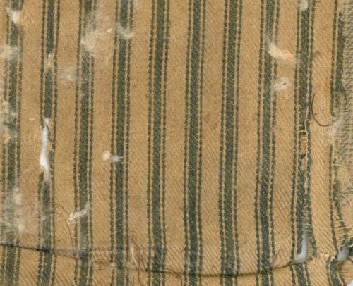 Innermost Ticking of Pew Cushion Fabric, with some cotton batting showing